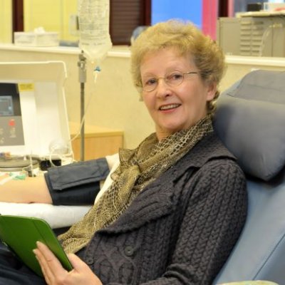 A older woman sitting in a hospital chair